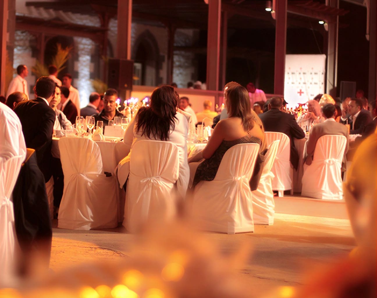 Guests at a formal dinner event at the Château de Bel Ombre
