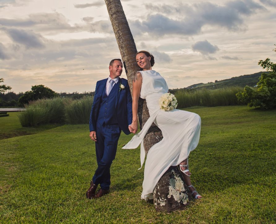 Couple celebrating their wedding in the picturesque garden of Le Château de Bel Ombre