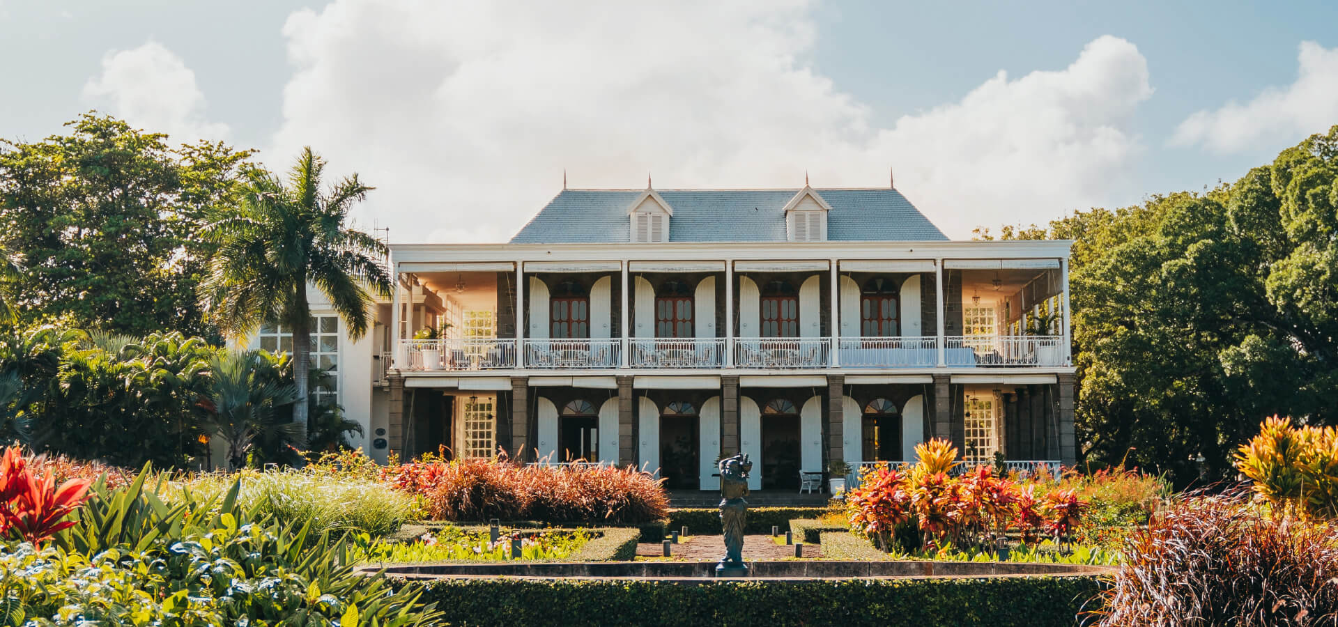 Exterior View over Le Château de Bel Ombre With French Style Garden